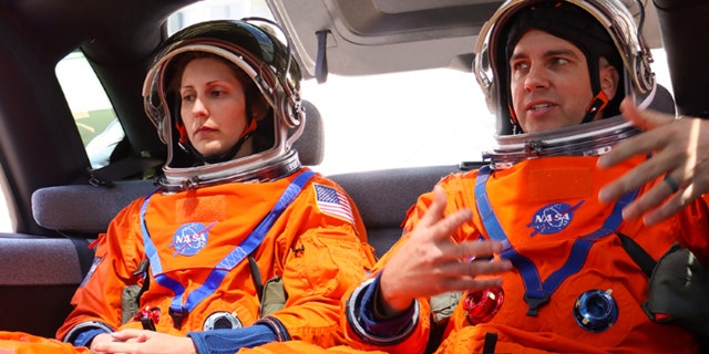 Technicians wore flight suits in the Canoo van to see how they might fit.