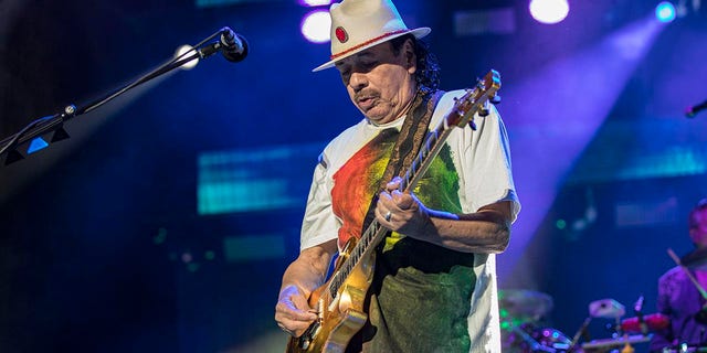 Guitarist Carlos Santana of Santana plays on stage at the North Island Credit Union Coliseum on June 17, 2022 in Chula Vista, California. 