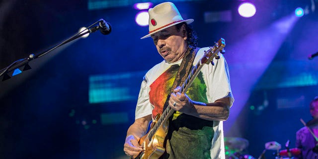 Guitarist Carlos Santana of Santana performs on stage at North Island Credit Union Amphitheatre on June 17, 2022 in Chula Vista, California. 