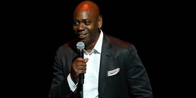 Dave Chappelle was supported by the comedy community after he was canceled by a local Minnesota venue earlier this week. He was pictured at a theatre dedication ceremony at his alma mater in June.