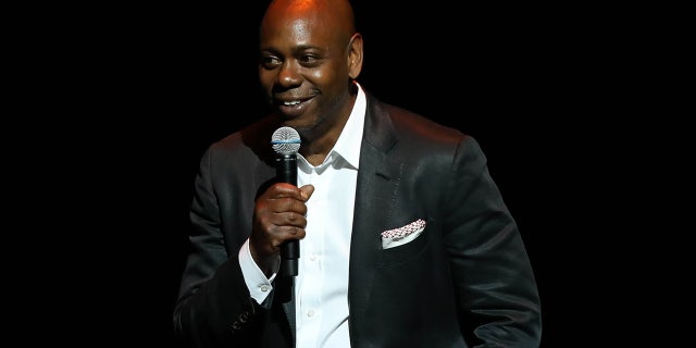 Dave Chappelle was supported by the comedy community after he was canceled by a local Minnesota venue earlier this week. He was pictured at a theatre dedication ceremony at his alma mater in June.