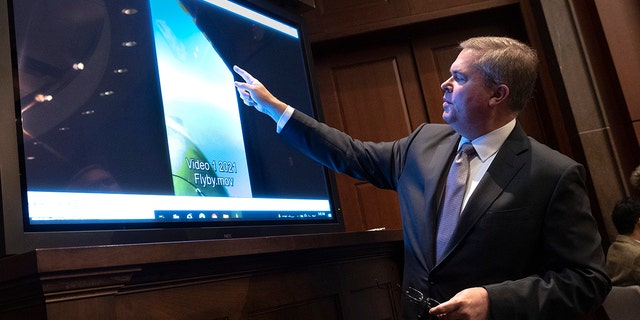 U.S. Deputy Director of Naval Intelligence Scott Bray explains a video of an unidentified aerial phenomena on May 17, 2022. 