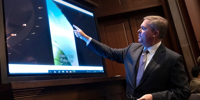 U.S. Deputy Director of Naval Intelligence Scott Bray explains a video of an unidentified aerial phenomena on May 17, 2022. 