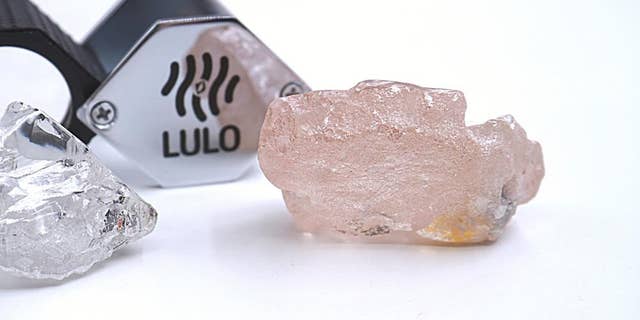 This photo supplied by Lucapa Diamond Company on Wednesday, July 27, 2022, shows the 170-carat pink diamond, right, recovered from Lulo, Angola.