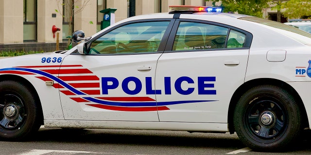 File-A Washington, DC Metropolitan Police Department police car is blocking a street near the White House.