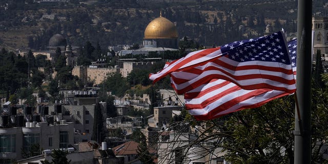 With the Dome of the Rock shrine in the background, U.S. flags fly ahead of President Joe Biden's visit to Jerusalem on Tuesday, July 12, 2022.