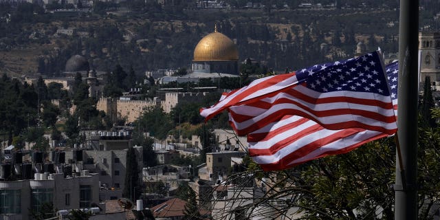 With the Dome of the Rock shrine in the background, U.S. flags fly ahead of a visit by President Joe Biden, in Jerusalem, Tuesday, July 12, 2022.