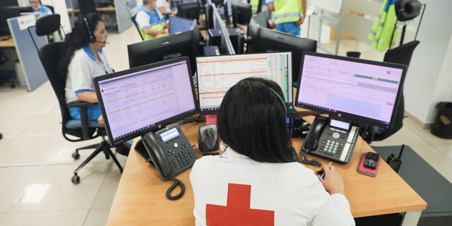 With temperatures rising around the world, it is important to understand the health risks associated with extreme heat.  Pictured, a woman works at the Madrid Community Emergency Medical Service call center during the second heat wave of the year in Madrid, Spain on July 14, 2022. 