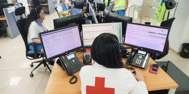 With heat rising around the globe, it's important to understand the health risks of extreme heat. Pictured: A woman works at the Community of Madrid Medical Emergency Service call centre during the second heatwave of the year, in Madrid, Spain, on July 14, 2022. 