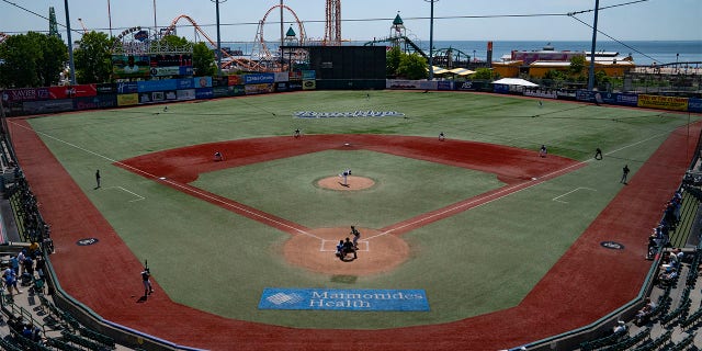 Infielders array in a traditional pattern as rules changes to restrict shifts are observed during a minor league baseball game between the Brooklyn Cyclones and Greensboro Grasshoppers, Wednesday, July 13, 2022, in the Coney Island neighborhood of the Brooklyn borough of New York. Major League Baseball is considering a pitch clock for next year along with shift limits, larger bases and restrictions on pickoff attempts.