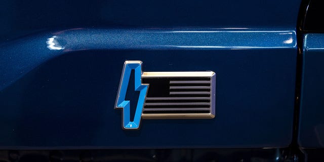 The Michigan-made Ford F-150 Lightning features an American flag logo.
