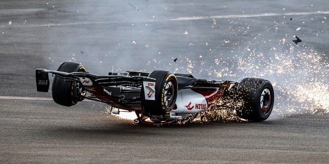 Zhou's car skidded down the track on its top.