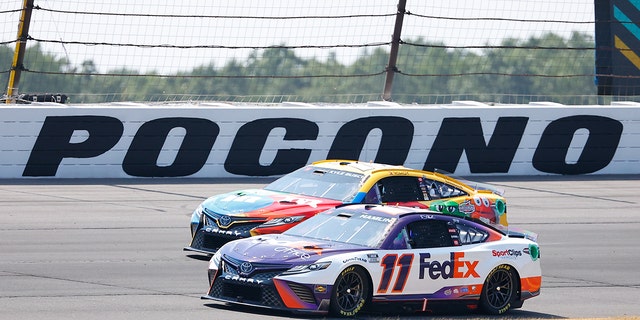 Denny Hamlin, #11, and Kyle Busch were disqualified from their first and second place finishes due to an identical rule infraction found on both of their cars.