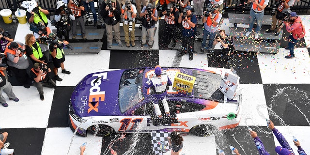 Denny Hamlin celebrated his Pocono win before his car was disqualified.