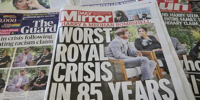 An arrangement of UK daily newspapers show front page headlines reporting on the story of the interview given by the Duchess of Sussex, Meghan Markle and her husband Britain's Prince Harry, Duke of Sussex, to media mogul Oprah Winfrey about their experiences with Buckingham Palace, in London, United Kingdom on March 9, 2021. 