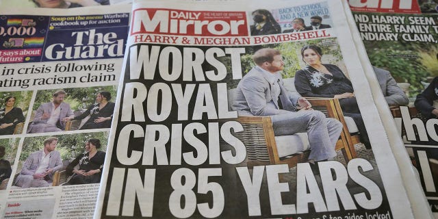 An arrangement of UK daily newspapers show front page headlines reporting on the story of the interview given by the Duchess of Sussex, Meghan Markle and her husband Britain's Prince Harry, Duke of Sussex, to media mogul Oprah Winfrey about their experiences with Buckingham Palace, in London, United Kingdom on March 9, 2021. 