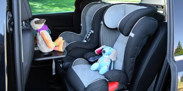 FILE - Seats for children mounted in a minivan. A 2-year-old Alambama boy died in a hot car after his grandfather failed to drop him off at daycare.