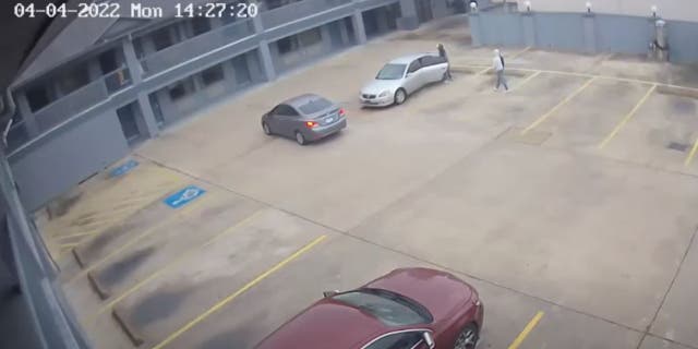 One of the suspects got in the backseat of the victim's car and pulled out a gun, according to police.