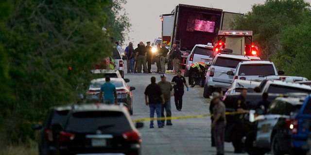 Police and other first responders work the scene where officials say dozens of people were found dead and others hospitalized with heat-related illnesses after a tractor-trailer containing illegal migrants was found on June 27, 2022, in San Antonio. 