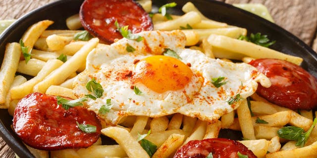 Huevos rotos, also known as Spanish broken eggs, is a recipe that's often served with French fries and chorizo sausage.