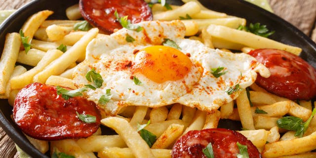 Huevos rotos, also known as Spanish broken eggs, is a recipe that's often served with French fries and chorizo sausage.