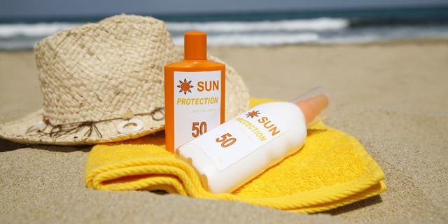 Sunscreen bottles on beach