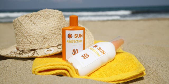 Sunscreen bottles on beach