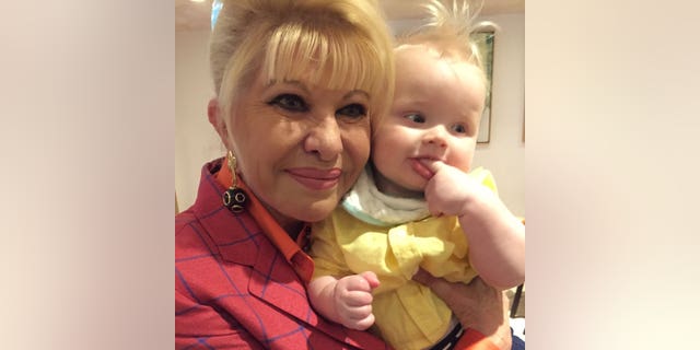 Ivana Trump holding her grandson.