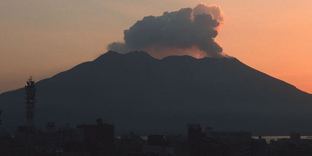 Sakurajima Volcano lets off some steam. About 7 thousand people live at the foot of this volcano, and Kagoshima city with a population of about half a million is located only ten kilometers to the west. Major eruptions occurred in 1476, 1779, 1914, 1946 and a smaller one in 1955, but the area within two kilometers of the summit remains an "off-limit zone". Sakurajima is 12 kilometers in diameter from east to west and 10 kilometers from north to south, with a circumference of 55 kilometers. The North Peak of the Sakurajima Volcano is 1117 meters (3665 feet), the Middle Peak is 1060 meters (3478 feet), and the South Peak is 1040 meters (3412 feet). 