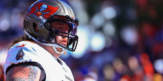 Ryan Jensen of the Tampa Bay Buccaneers warms up before a game against the Los Angeles Rams during the NFC Division Playoffs game at Raymond James Stadium in Tampa, Florida on January 23, 2022.