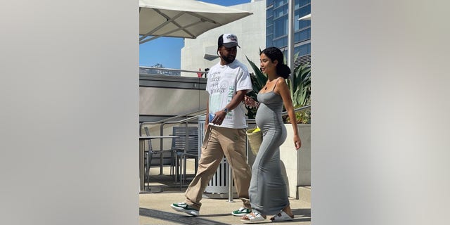 Jhené Aiko reveals her baby bump while stepping out to lunch with boyfriend Big Sean in Beverly Hills on Saturday.