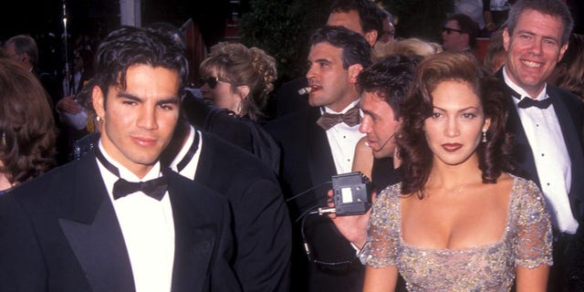 Jennifer Lopez, right, with her first husband Ojani Noa. 
