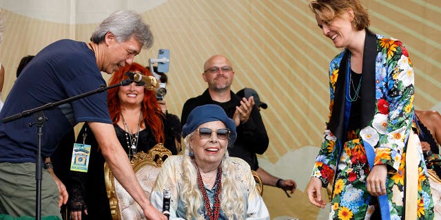 Brandi Carlile introduces Joni Mitchell for a special Joni Jam at the 2022 Newport Folk Festival at Fort Adams State Park on July 24, 2022.