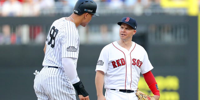 Aaron Judge, No. 99 of the New York Yankees, and Andrew Benintendi, No. 16 of the Boston Red Sox, talk during the first game of the London Series between the New York Yankees and the Boston Red Sox at London Stadium on Saturday, June. October 29, 2019 in London, England.