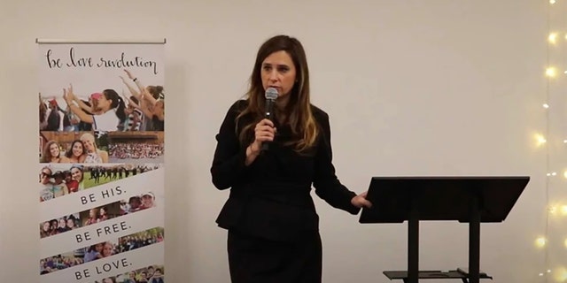 Dr. Kristin Collier speaks during a Be Love Revolution event. 
