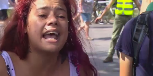 Photo of mother Arabella Foss-Yarbrough confronting protesters following the fatal police shooting of Andrew "Teckle" Sundberg. (Fox 9)