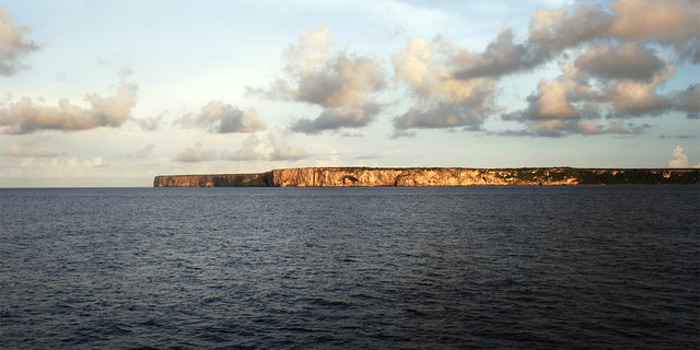 The sun sets over Mona Island, an uninhabited land mass in between Puerto Rico and the Dominican Republic.