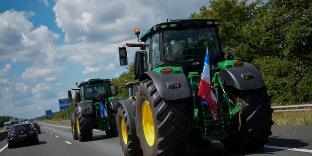 Demonstrating farmers slow down traffic on a motorway near Venlo, southern Netherlands, Monday, July 4, 2022.