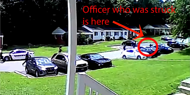 Gastonia Police Department shows a police officer getting hit by the suspect's car.