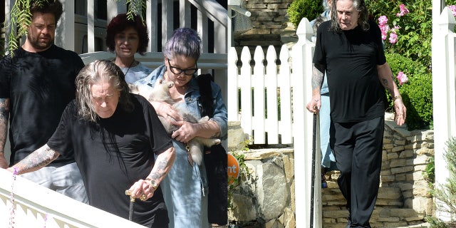 Ozzy Osbourne spotted using a cane while walking with his family in Los Angeles
