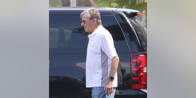 Paul Pelosi walks a beach in Italy over Independence Day weekend.