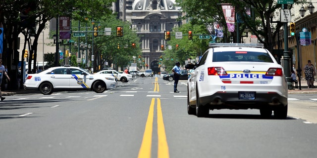 FILE- Philadelphia police patrol the city.