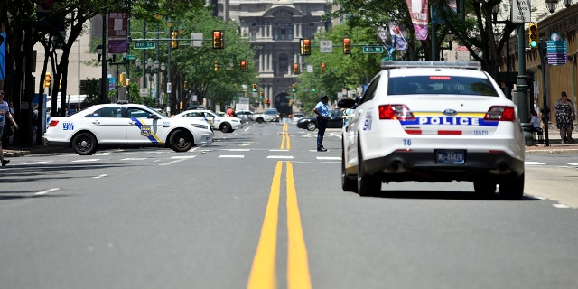 File-Philadelphia police patrol the city.