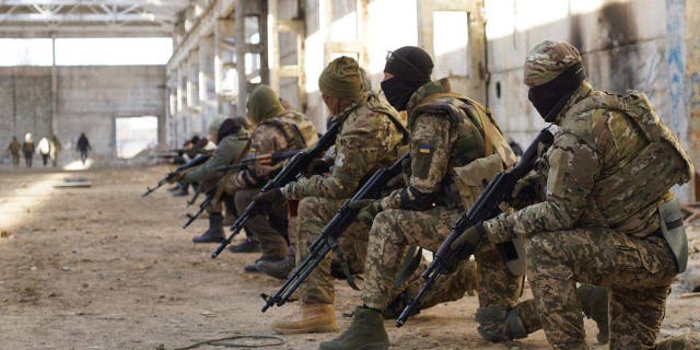 Soldiers of the Belarusian Kastus Kalinouski Regiment train in Ukraine.