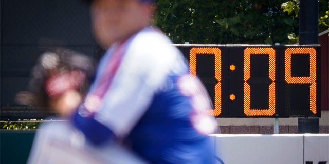 A pitch clock is deployed to restrict pitcher preparation times during a minor league baseball game between the Brooklyn Cyclones and Greensboro Grasshoppers, Wednesday, July 13, 2022, in the Coney Island neighborhood of the Brooklyn borough of New York. Major League Baseball is considering a pitch clock for next year along with shift limits, larger bases and restrictions on pickoff attempts.  