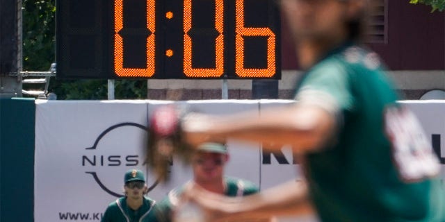 A pitch clock is deployed to restrict pitcher preparation times during a minor league baseball game between the Brooklyn Cyclones and Greensboro Grasshoppers, Wednesday, July 13, 2022, in the Coney Island neighborhood of the Brooklyn borough of New York. Major League Baseball is considering a pitch clock for next year along with shift limits, larger bases and restrictions on pickoff attempts.