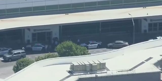 Dallas police engage female shooter who opened fire by airport ...