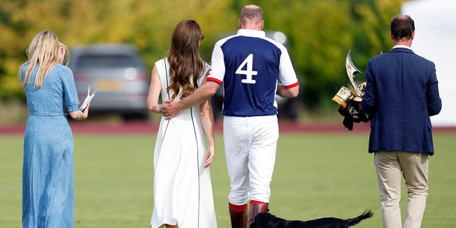 Kate, Duchess of Cambridge and Prince William, Duke of Cambridge, with their dog 'Orla', attend the Out-Sourcing Inc. Royal Charity Polo Cup at Guards Polo Club, Flemish Farm on July 6, 2022 in Windsor, England. 