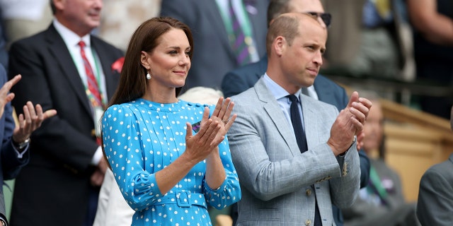 Britain's Prince William Duke of Cambridge, and his wife Kate Middleton , Duchess of Cambridge, applaud in the royal box during the men's singles quarter-final match between Novak Djokovic of Serbia and Jannik Sinner of Italy at Wimbledon Tennis Championship in London, Britain, on July 5, 2022.