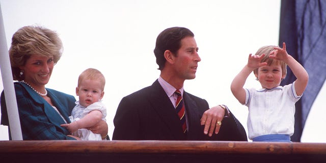 Princess Diana (1961 - 1997), Prince Charles and their sons Prince Harry (left) and William leaving Italy on board the royal yacht Brittania after a tour, April 1985. The princess is wearing a green and black check suit by the Emanuels. (Photo by Jayne Fincher/Princess Diana Archive/Getty Images)